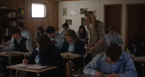 Lesbian Student and Teacher Kissing in Classroom
